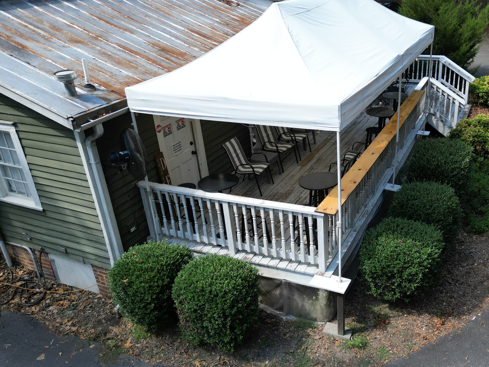 A covered deck set up for a private event